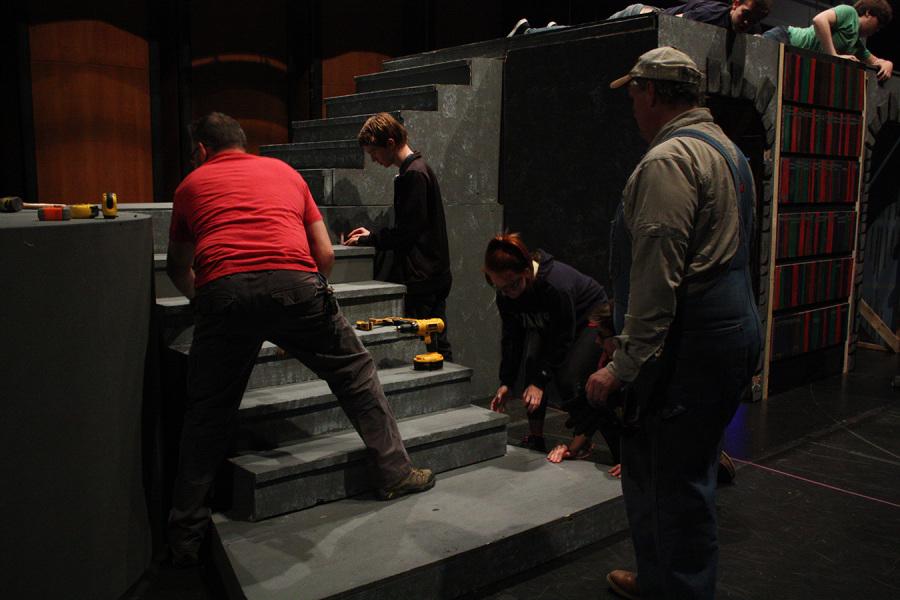 Members of theater help move the stage of Beauty and the Beast to the MISD Center for the Performing Arts. 