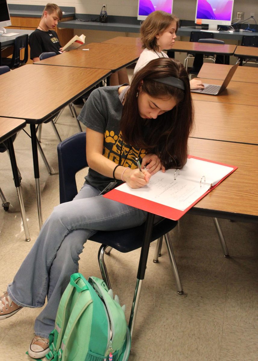 Senior Olivia Knight working on homework during advisory.