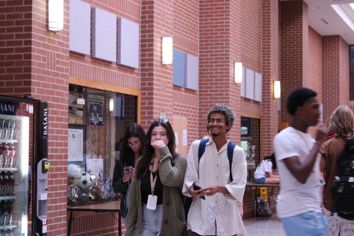 Students walking through the main cafeteria hall.