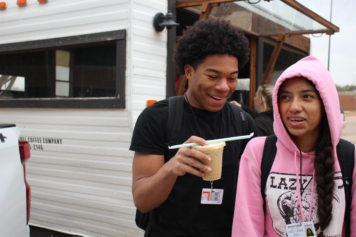 Students stand in front of the Flying Squirrel Coffee trailer