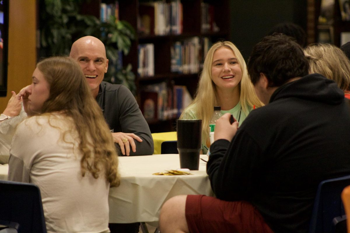 Senior and parents enjoy a senior lunch