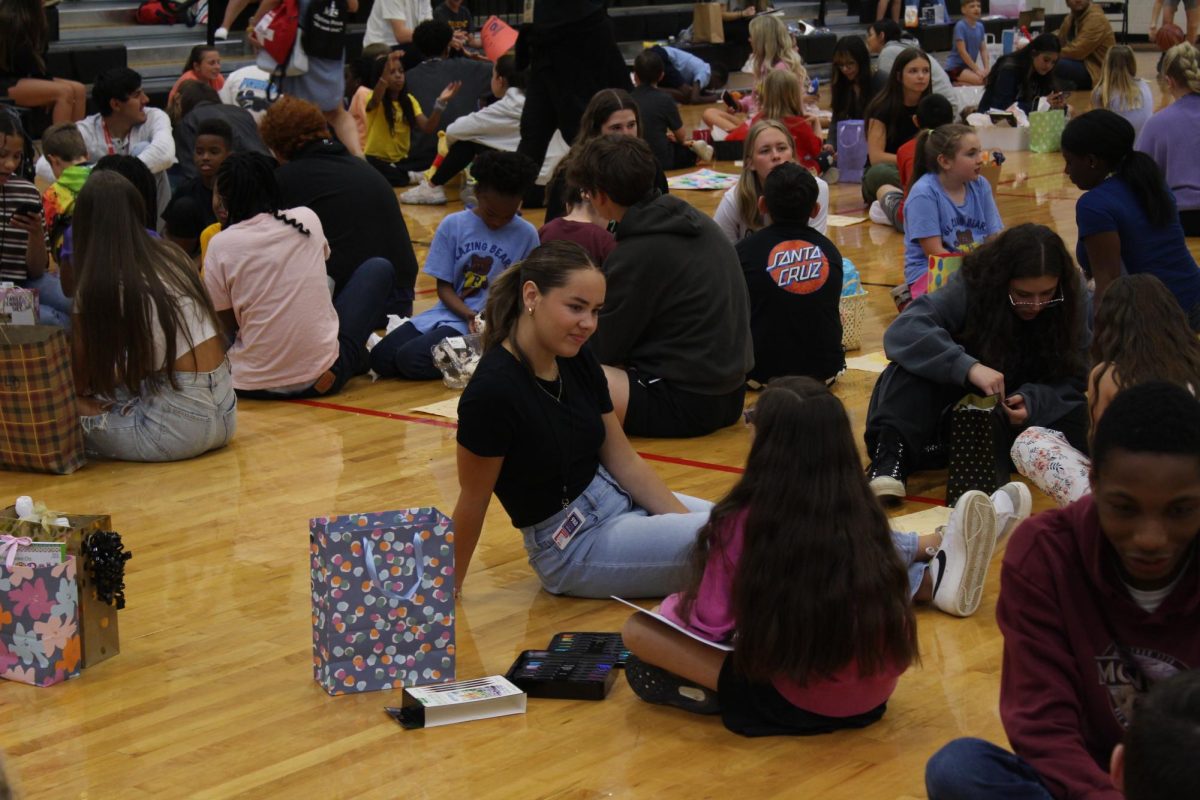 Senior talking to her pen pal during the meet and greet