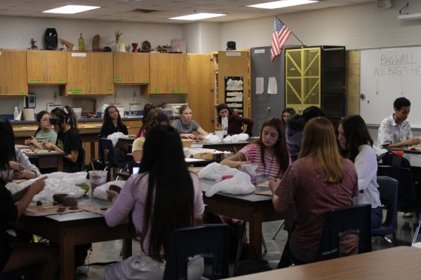 Students design their projects in the art classroom.